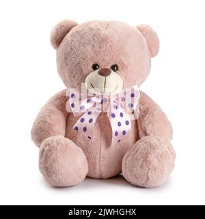 Children's toy teddy bear with pink bows in dots isolated Stock Photo