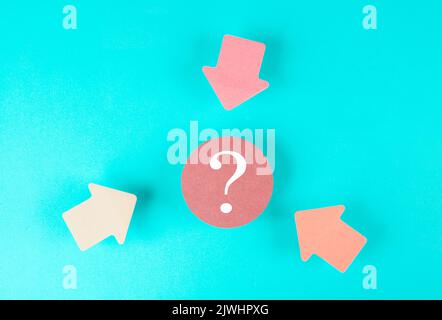 Arrows pointing to a question mark in the middle looking for an answer, searching for knowledge, problem solving, business and education concept Stock Photo