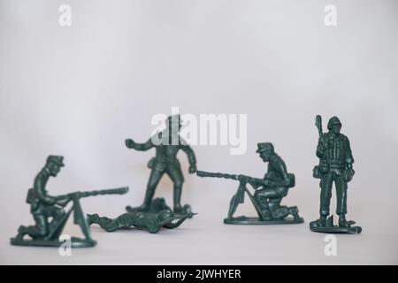 Children's plastic soldiers on a white background close-up, game Stock Photo