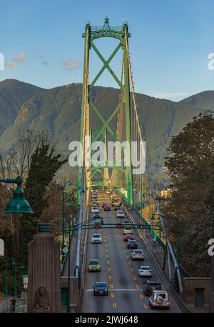Lions Gate Bridge with traffic in Vancouver Canada, View from Stanley Park. Built in the 1930s, Vancouver's Lions Gate Bridge spans across Burrard Inl Stock Photo