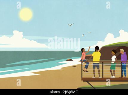 Friends on balcony at sunny, summer ocean beach Stock Photo