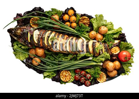 Grilled sliced fish banquet dish with vegetables Stock Photo