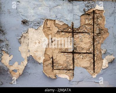 cracked concrete wall showing its inner steel structure Stock Photo