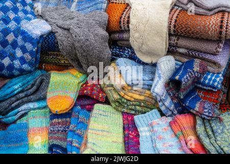 A Lot of various cotton socks and knitted woollen winter socks, top view. Handmade. Stock Photo