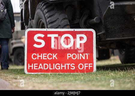 Ukrainian military checkpoint with tank armoured personnel vehicle on boarder of Ukraine. Stop check point red sign army equipment. Stock Photo