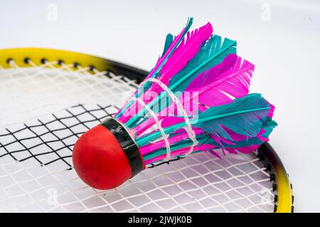 Shuttlecock with badminton racket isolated Stock Photo