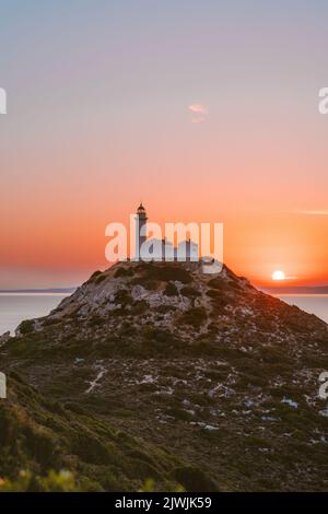 Lighthouse on hill above sea sunset landscape in Turkey travel Knidos landmarks Stock Photo