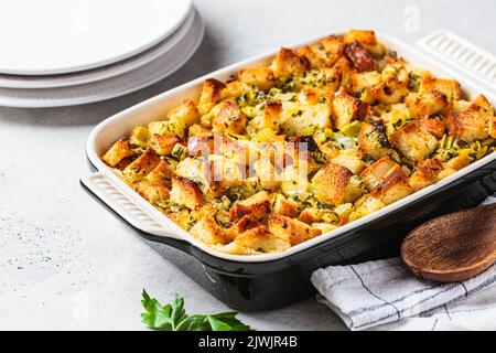 Traditional Thanksgiving stuffing. Bread casserole with celery and parsley. Stock Photo