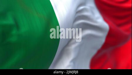 Close-up view of the italian national flag waving in the wind. Italy is a country located in the middle of the Mediterranean Sea, in Southern Europe. Stock Photo