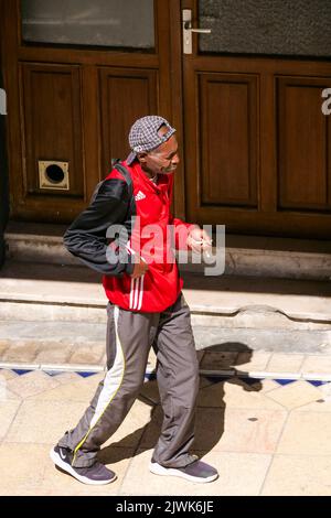 Drunk homeless walking in the street, Vichy, Allier, AURA Region, Central France Stock Photo
