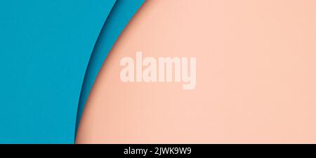 Abstract color papers geometry flat lay composition background with blue color curved lines and shapes on pastel pink background