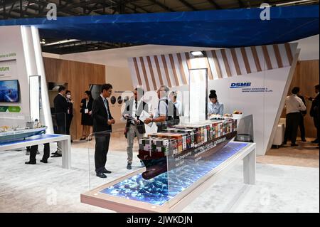 MILAN, ITALY - SEPTEMBER 6, 2022: a view of the DSME stand during Gastech 2022 trade show event in Milan Fair. Visitors and people in the hall walk through exhibitors stands and exhibit booths. Stock Photo