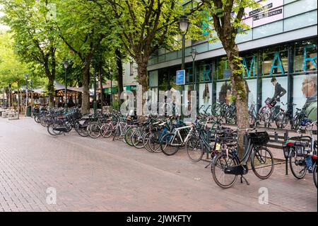 Hilversum, North Holland, The Netherlands, 07 21 2022 - Row of bikes in the main shopping streets in the city center Stock Photo