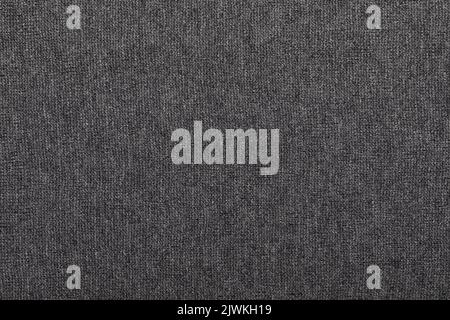 Dark grey melange knitted fabric made of heather mixed yarn textured background Stock Photo