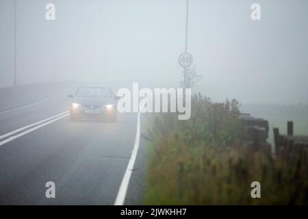 West Yorkshire, 6th September 2022  Drivers navigate through thick mist on the A644 in West Yorkshire as the heatwave gives way to rain and misty weather.   Credit: Windmill Images/Alamy Live News Stock Photo
