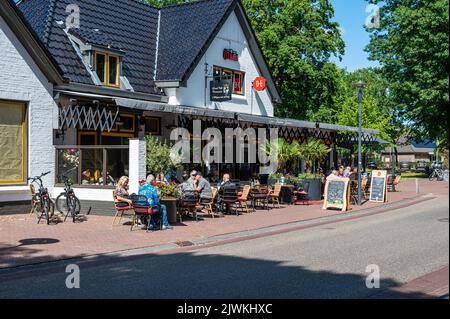 Norg, Drenthe, The Netherlands, 07 20 2022 - Restaurant with sunny terrace along the road Stock Photo