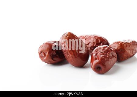 Dried Red Dates Unabi Fruits or Jujube. Isolated on White with Copy Space Stock Photo