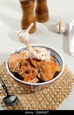Spicy Crab Curry, SIngapore Style Crab Stew. Served on Ceramic Bowl Stock Photo