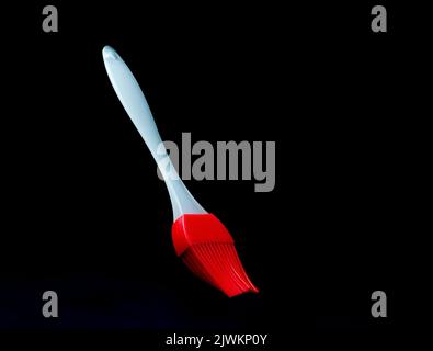 silicon basting brush on a black background Stock Photo