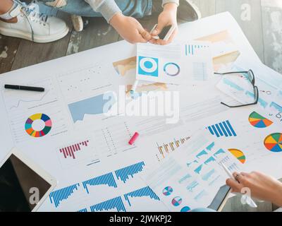 millennials teamwork graphs startup project Stock Photo