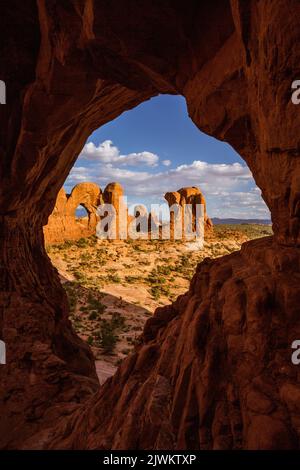 The Parade of Elephants and the back of Double Arch framed by Cove Arch in Arches National Park, Moab, Utah. Stock Photo