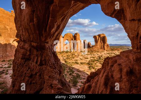 The Parade of Elephants and the back of Double Arch framed by Cove Arch in Arches National Park, Moab, Utah. Stock Photo