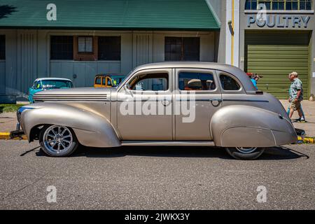 Falcon Heights, MN - June 17, 2022: Low perspective side view of a 1939 Graham Model 97 Sharknose Sedan at a local car show. Stock Photo