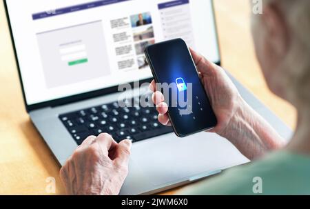 Senior and phone with lock password to protect data in online bank website. Old woman with smartphone. Cyber security and personal information safety. Stock Photo