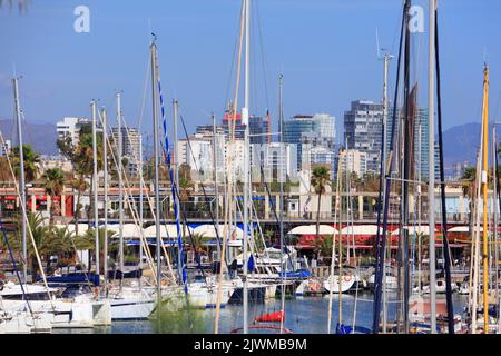 BARCELONA, SPAIN - OCTOBER 7, 2021: Yachts and sailboats in Marina Port Vell in Barcelona, Spain. Marina Port Vell is one of most recognizable harbors Stock Photo