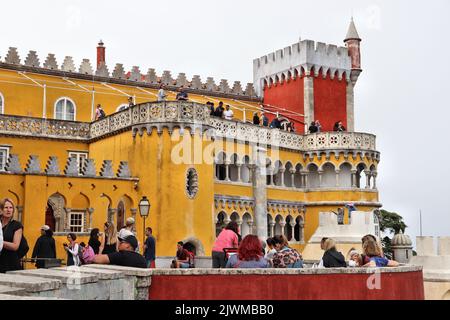 SINTRA, PORTUGAL - MAY 21, 2018: Tourists visit Pena Palace tourist attraction in Sintra. Portugal had 12.7 million foreign visitors in 2017. Stock Photo