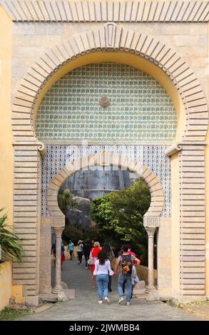 SINTRA, PORTUGAL - MAY 21, 2018: Tourists visit Pena Palace tourist attraction in Sintra. Portugal had 12.7 million foreign visitors in 2017. Stock Photo