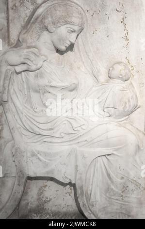 Antique religious bas relief in white marble Stock Photo