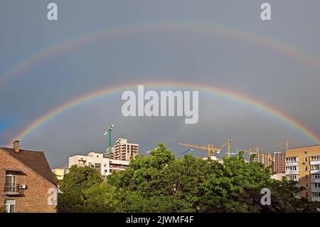 The double rainbow over the city of Kyiv, Ukraine Stock Photo