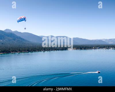 Two people parasailing in South Lake Tahoe, California. Stock Photo