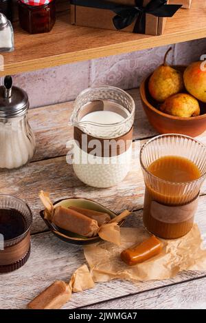 handmade caramel candies on the kitchen table. Stock Photo