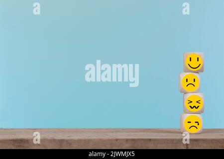 Emoticon icons face on Wooden Cube , Costumer service concept Stock Photo