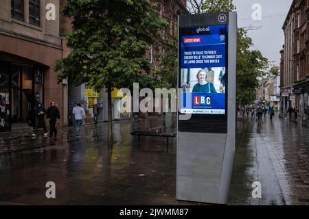 Glasgow, UK, 6th Sept. 2022. Digital display boarding shows images of Conservative party leader Liz Truss on the rainy afternoon that she became the country’s Prime Minister, in Glasgow, Scotland, 6 September 2022. Photo credit: Jeremy Sutton-Hibbert/Alamy Live News. Stock Photo