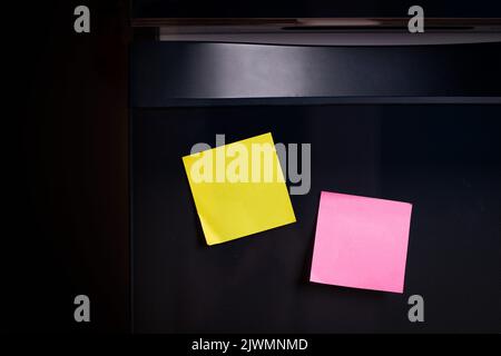 Empty note paper sheet on refrigerator door. Text memory story of life in note paper Stock Photo
