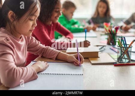 Korean Schoolgirl Writing Taking Notes Learning During Class At School Stock Photo