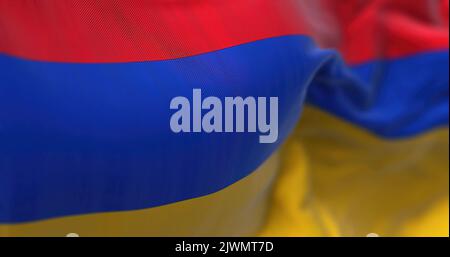 Close-up view of the armenian national flag waving in the wind. Armenia is a landlocked country located in the Armenian Highlands of Western Asia. Fab Stock Photo