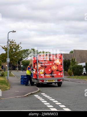 Tesco food delivery van and driver delivering food to customers, Cherry Willingham Lincolnshire 2022 Stock Photo