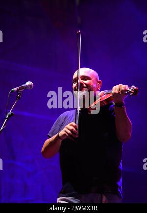 Vicenza, VI, Italy - September 4, 2022: Concert of an Italian band called NOMADI and VIOLINIST REGGIOLI SERGIO Stock Photo