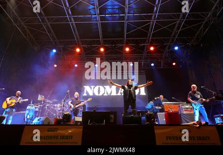 Vicenza, VI, Italy - September 4, 2022: Concert of Italian band NOMADI and banner of FONDAZIONE IRRIV Stock Photo