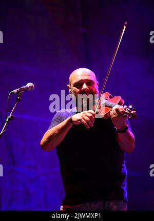 Vicenza, VI, Italy - September 4, 2022: Concert of an Italian band called NOMADI and VIOLINIST REGGIOLI SERGIO Stock Photo