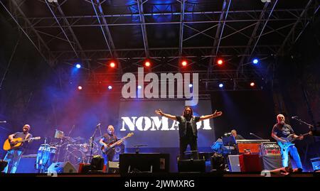 Vicenza, VI, Italy - September 4, 2022: Live Concert of an Italian band called NOMADI and big TEXT on the stage Stock Photo