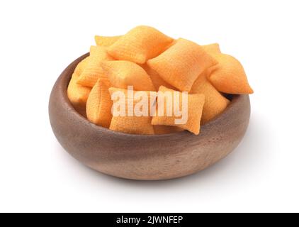 Wooden bowl of wheat cereal pillows isolated on white Stock Photo