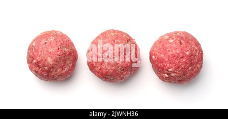 Top view of  three fresh raw homemade meatballs isolated on white Stock Photo