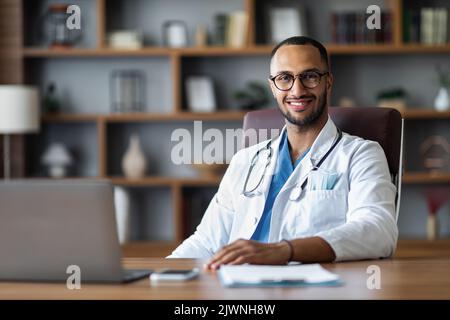 Handsome middl eastern doctor posing at clinic Stock Photo