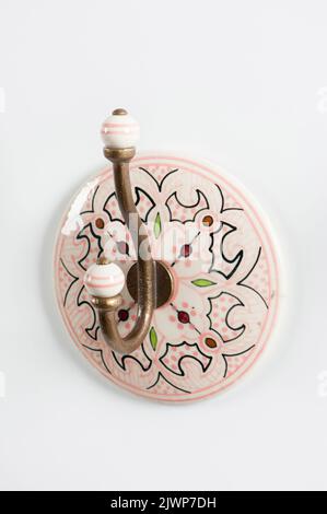 Decorative ceramic wall hook for clothing. Stock Photo