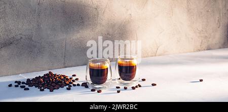 Two glass cups of espresso with coffee crema Stock Photo